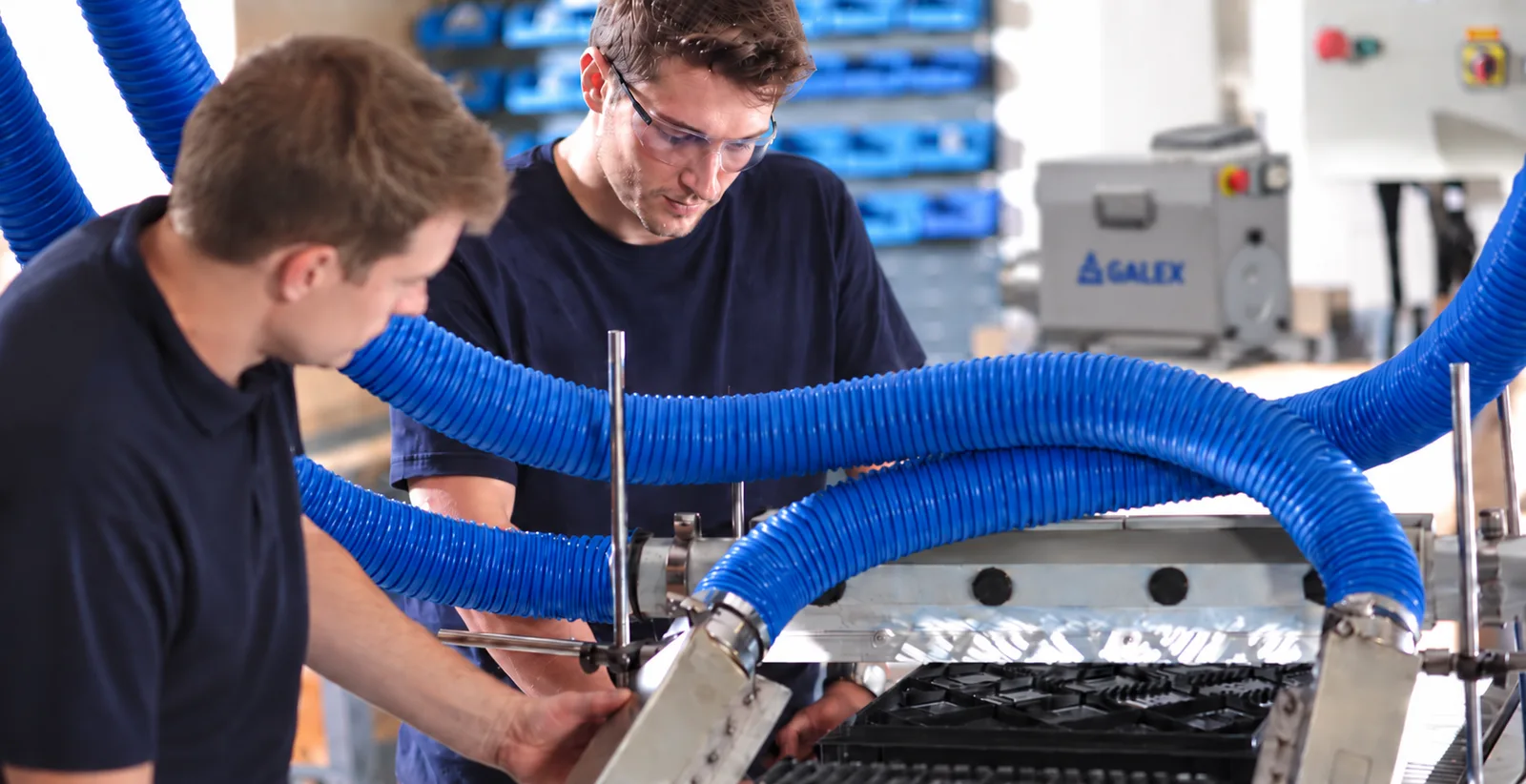 GALEX technicians working on an air knife system